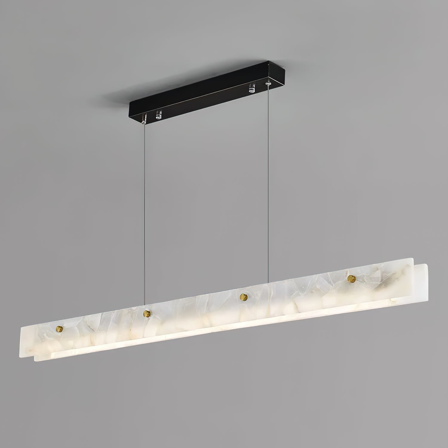 Clérachic alabaster linear pendant shown at an angle, its black rectangular canopy and twin suspension cables against a soft grey studio wall.
