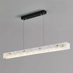 The Clérachic pendant photographed square to the camera, showing the full run of alabaster and the slim black mounting bar above.