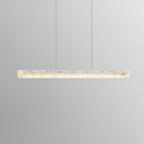 Clérachic linear bar lit and level in a soft grey studio, the alabaster reading warm and evenly diffused end to end.