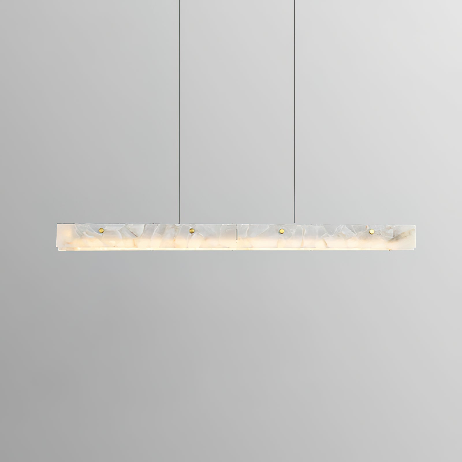 Clérachic linear bar lit and level in a soft grey studio, the alabaster reading warm and evenly diffused end to end.