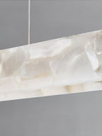 Clérachic alabaster panel photographed close, its translucent veining and mineral cloudiness lit from within.