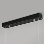 The Clérachic canopy in close-up, a slim matte black bar with the two suspension cables leaving its underside.