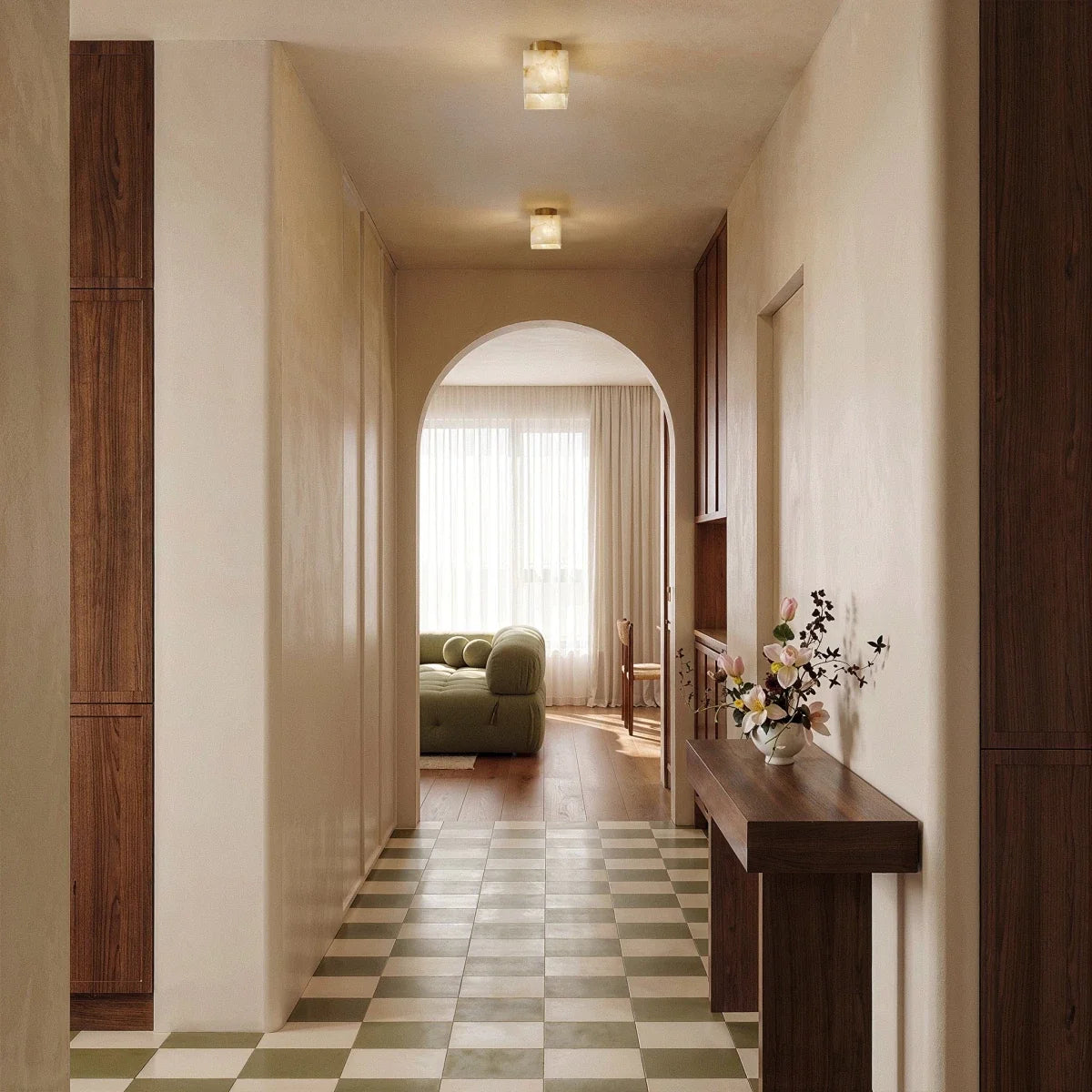 Clérachic two square alabaster ceiling lights lit along a hallway with an arched opening and a green checkered floor.