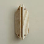 Beige jade panels on the Clérachic wall sconce, amber veining running diagonally either side of the open brass gap.