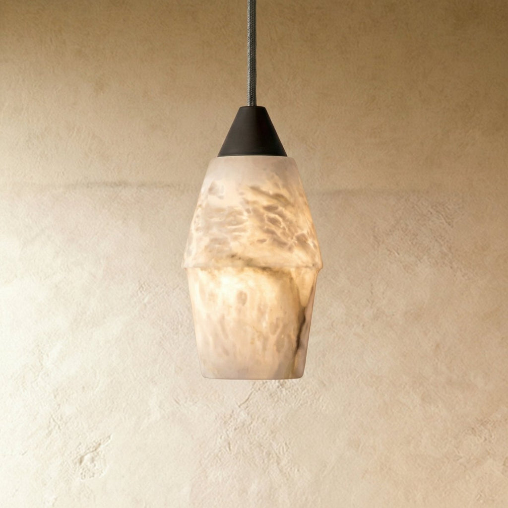Clérachic alabaster pendant with a faceted, veined stone shade and dark metal cap, lit softly on a grey cord.