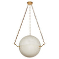 The Clérachic pendant's creamy alabaster sphere, cradled by brass pin arms at its seam, hangs from a brass canopy.