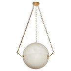 The Clérachic pendant's creamy alabaster sphere, cradled by brass pin arms at its seam, hangs from a brass canopy.