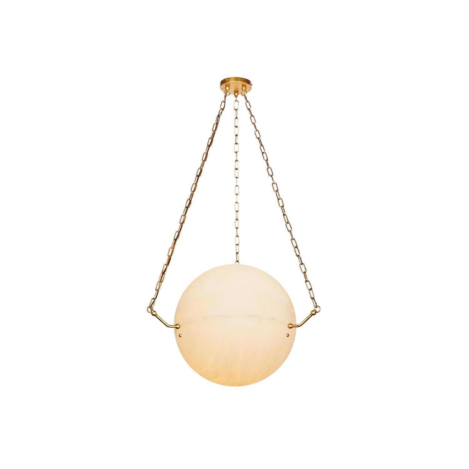 Clérachic brass-chained alabaster pendant photographed at full drop, the stone globe compact beneath its canopy.
