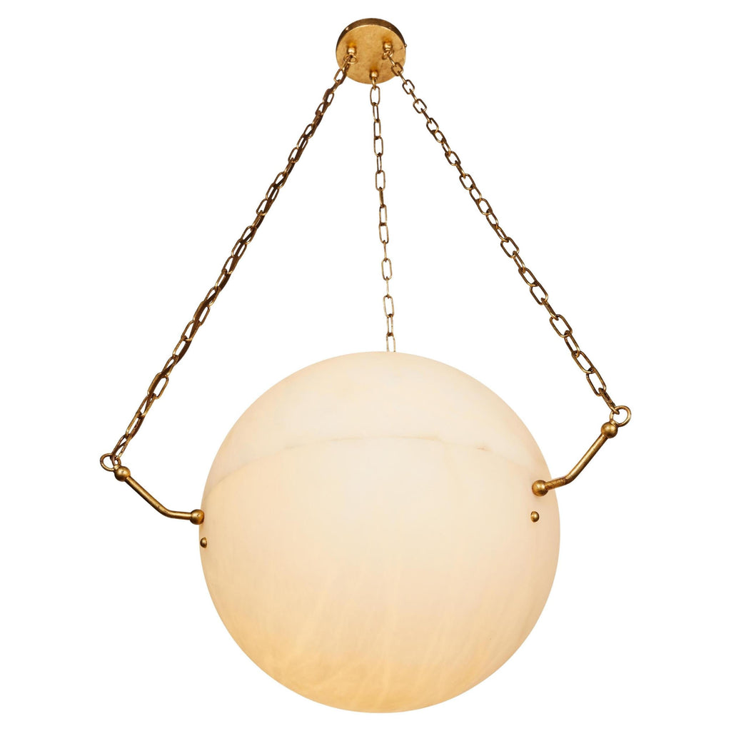 The Clérachic pendant close up in brass, warm cream alabaster filling the frame between three brass chains.
