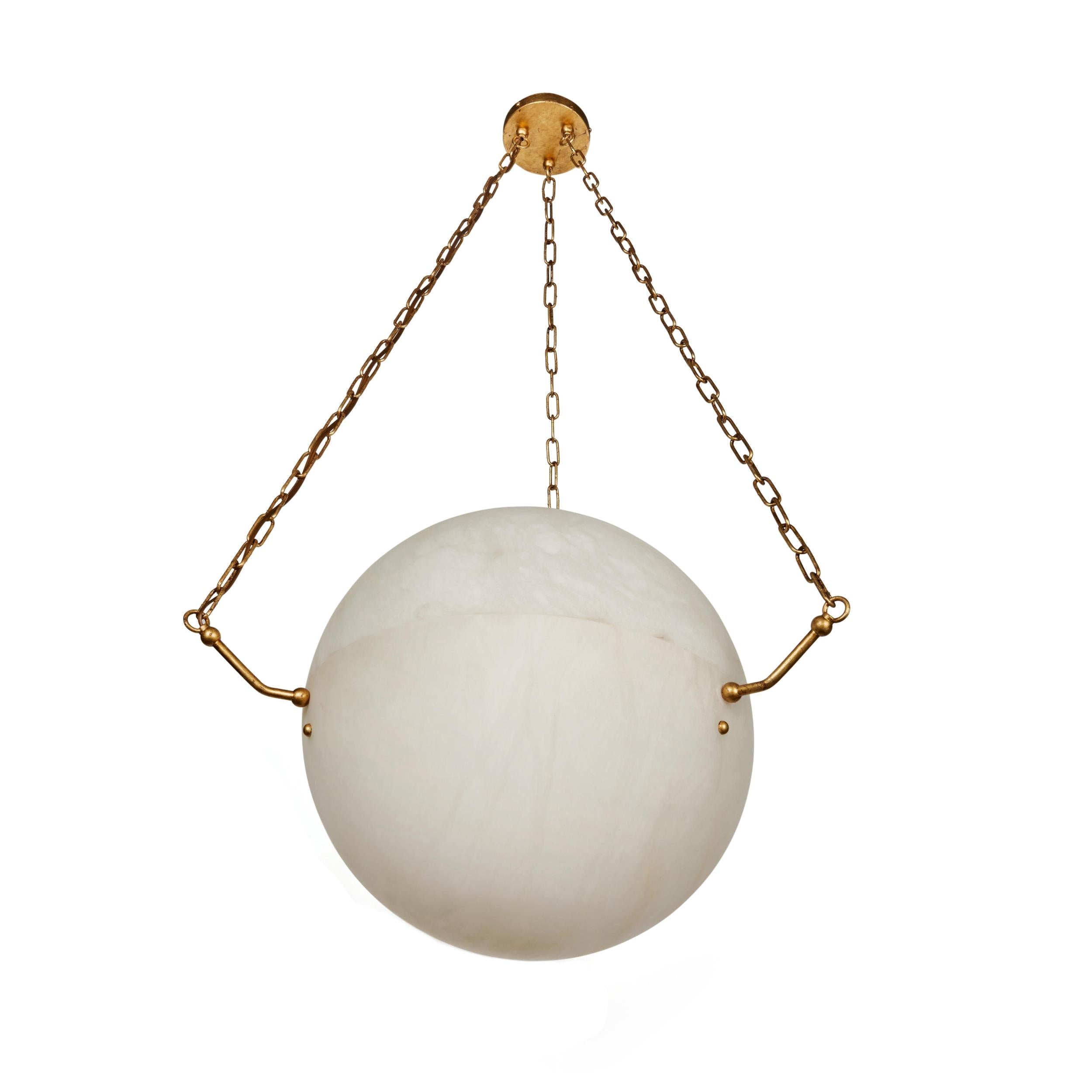 Clérachic alabaster sphere on brass chains at three-quarter view, brass canopy and pin arms clearly shown.