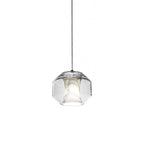 The wide barrel Clérachic Alabaster Pendant Light unlit on its cable, showing the eight-sided cut of the clear glass shell.