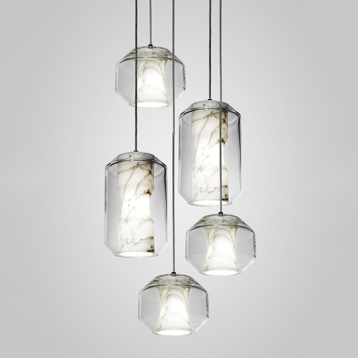Five Clérachic Alabaster Pendant Lights lit in a mixed-size cluster, showing how the two profiles read hung side by side.