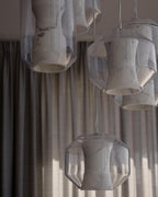 Daylit close-up of a Clérachic Alabaster Pendant Light cluster, the open bases and faceted glass edges clearly visible.