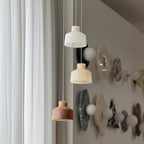 Clérachic Alabaster Pendant Light as a three-head cluster, the shades hung at different heights over a hallway corner.