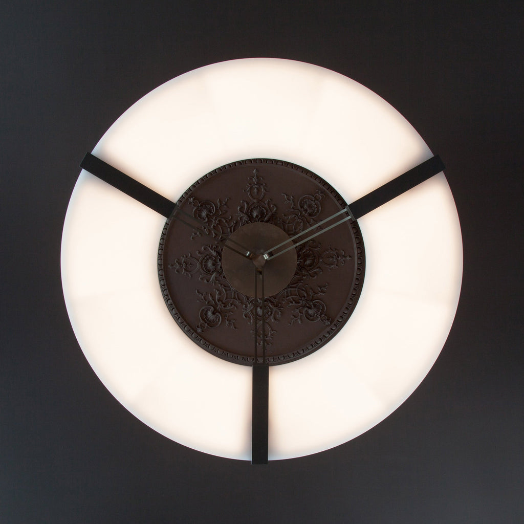 Clérachic Alabaster Ring Chandelier seen straight from below, a ring of warm light circling the dark ceiling rose at its centre.