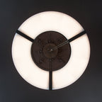 Clérachic Alabaster Ring Chandelier seen straight from below, a ring of warm light circling the dark ceiling rose at its centre.