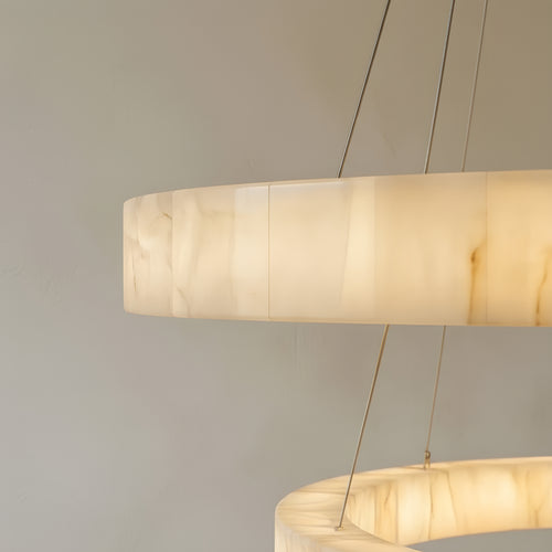 Close view of the lit calcite band, the fine vertical joints between the stone segments and the ivory and amber veining glowing from inside the stone