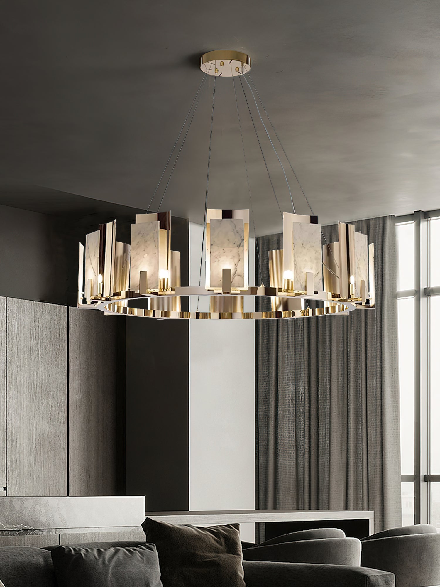 Clérachic Alabaster Ring Chandelier hung low in a grey lounge, the polished ring mirroring the lamplight along its outer band.