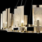 Close-up of the Clérachic Alabaster Ring Chandelier, showing the grey veining in each stone panel and the curved metal shields.