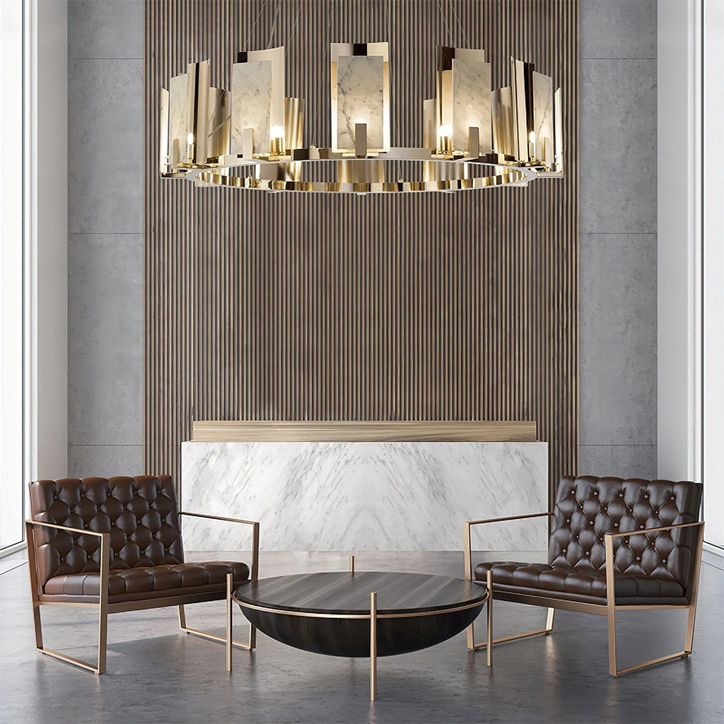 Clérachic Alabaster Ring Chandelier over two buttoned leather armchairs, glowing against a fluted wood and marble wall.