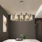 Clérachic Alabaster Ring Chandelier above a marble breakfast table, warming a taupe dining nook set with cups and eucalyptus.