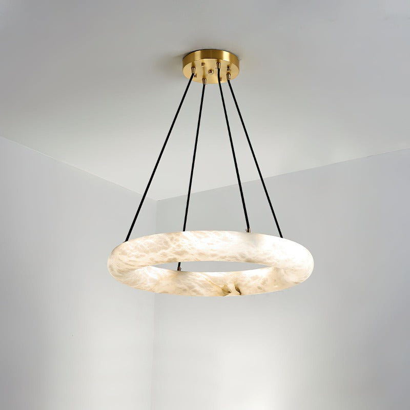 Clérachic Alabaster Ring Chandelier in the smaller span, one unbroken stone ring on four black cords from a brass canopy.