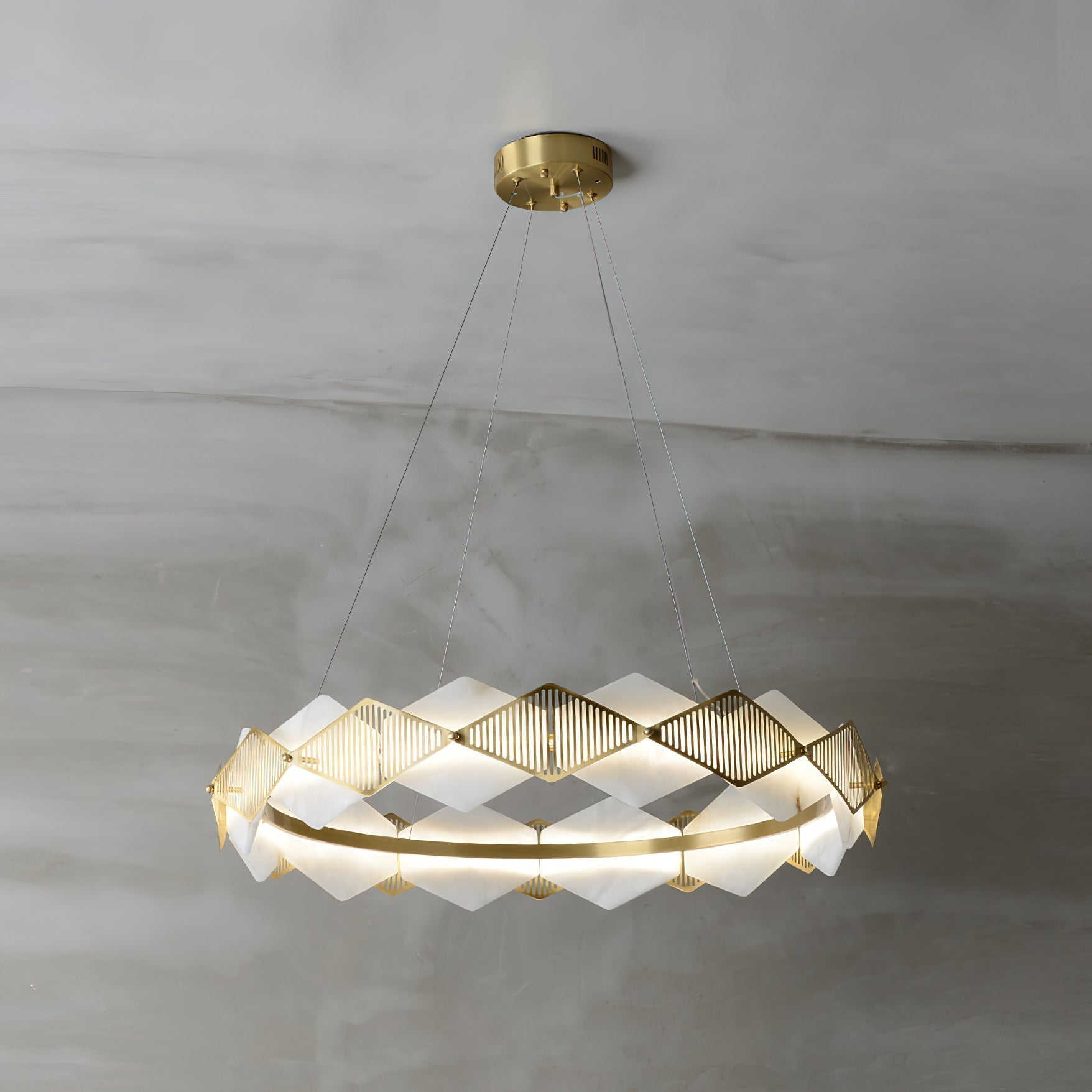 Front view of the Clérachic Alabaster Ring Chandelier, warm light washing through the diamond alabaster panels.