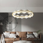 Clérachic Alabaster Ring Chandelier lit above a tan leather sofa, hung beside a large black wall clock and fluted panel.