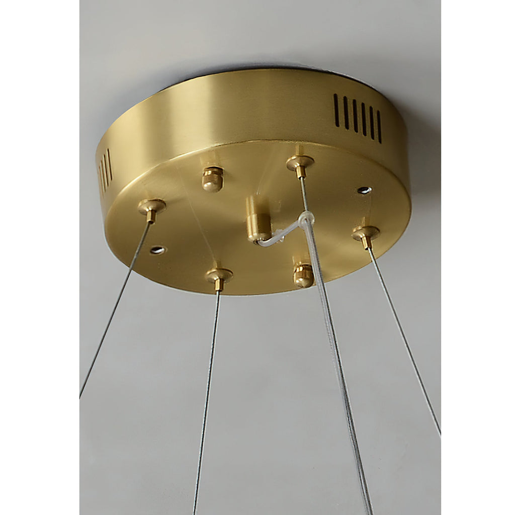Detail of the brass ceiling canopy on the Clérachic Alabaster Ring Chandelier, vented and carrying four steel cables.
