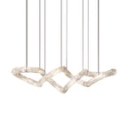 Full run of the Clérachic alabaster ring chandelier on fine suspension cables, showing every linked loop end to end.