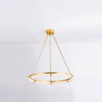 Clérachic Alabaster Ring Chandelier hung from a white ceiling in a bright room, floating clear of the wall behind it.