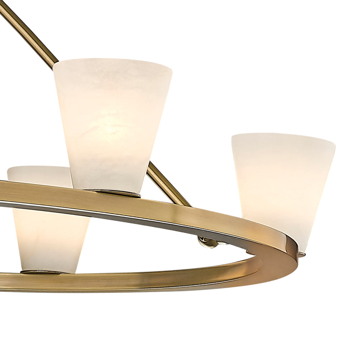 Three alabaster cones on the Clérachic ring chandelier, their veining catching the light above the brushed gold rim.