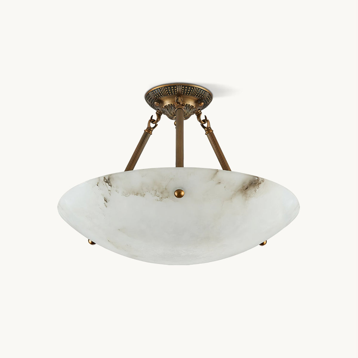 A Clérachic semi-flush ceiling light with a veined alabaster bowl and three antique brass arms, on a plain off-white backdrop.