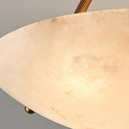 Close view of the warm alabaster glow, with fine veining across the bowl of this Clérachic ceiling light.