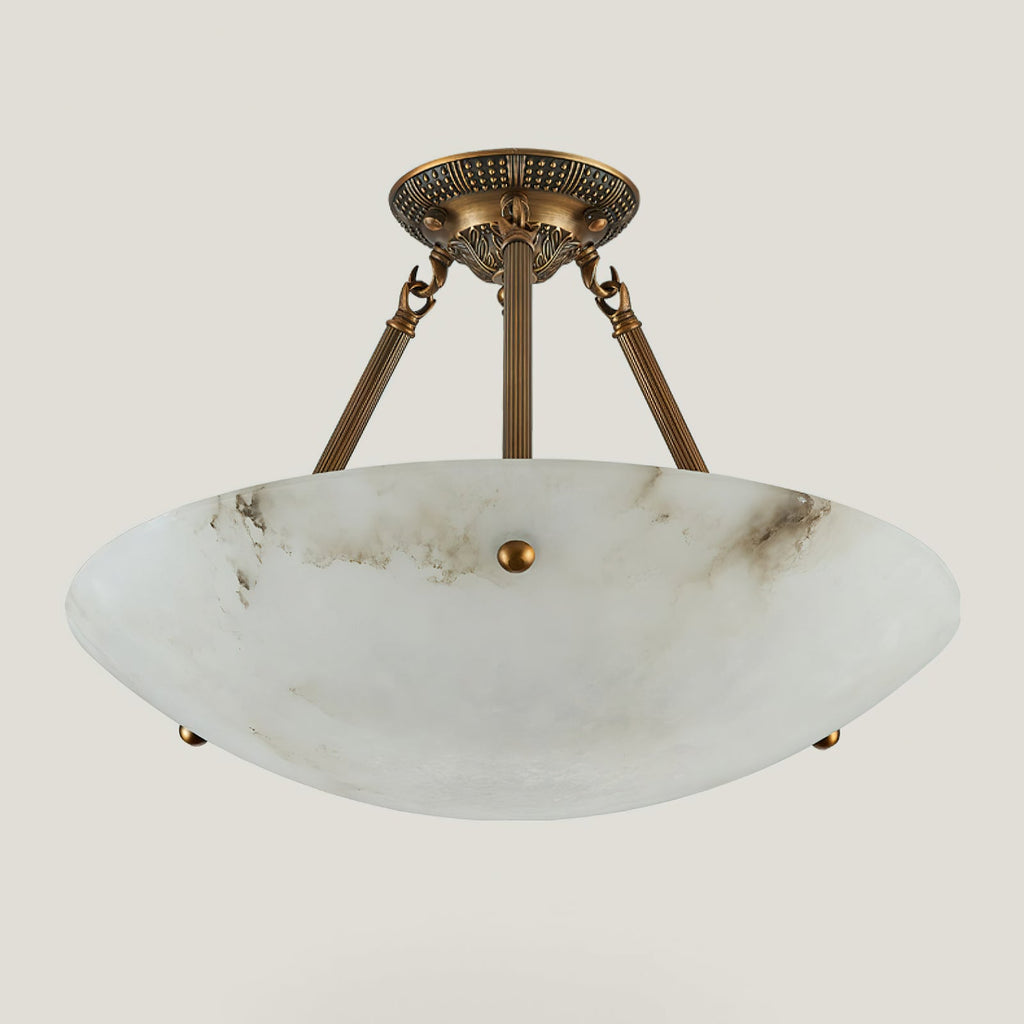 A Clérachic alabaster semi-flush ceiling light on a pale backdrop, with a cream-white bowl and three antique brass arms.