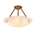 A Clérachic alabaster ceiling light, lit and shown whole on white, with its wide shallow bowl and three brass arms.