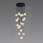 Clérachic alabaster sphere cluster hanging from a round black canopy against a soft grey backdrop, the spheres at many different heights.