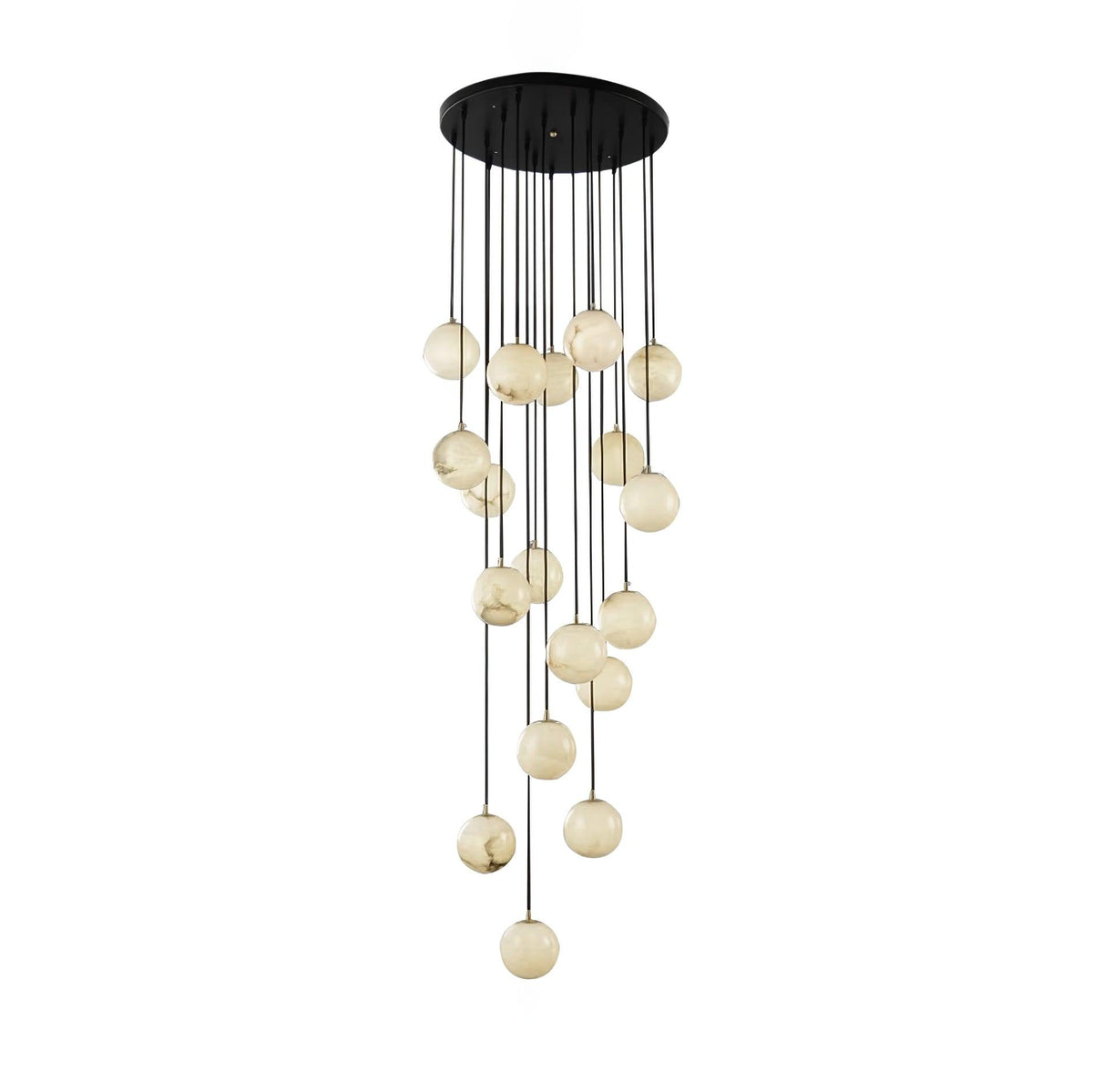 Clérachic alabaster sphere cluster on a white backdrop, the spheres unlit and showing grey and honey veining.