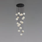 Clérachic cluster of pale, white-toned alabaster spheres hanging from a round black canopy, on a grey backdrop.