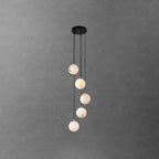 Five Clérachic alabaster spheres at stepped heights from a round black canopy, in front of a dark grey textured wall.