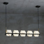 The linear Clérachic box chandelier, five alabaster cubes threaded along one long black bar.