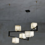 Clérachic box chandelier in the seven-cube size, its black arms stepped at two heights.
