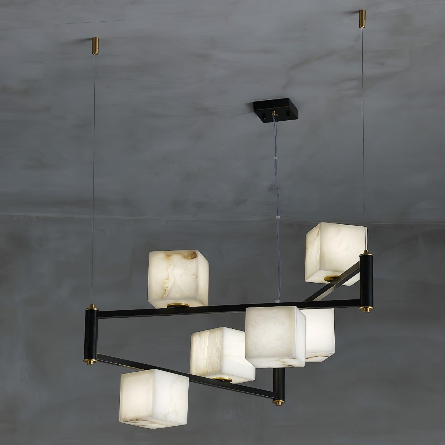 Clérachic box chandelier in the seven-cube size, its black arms stepped at two heights.