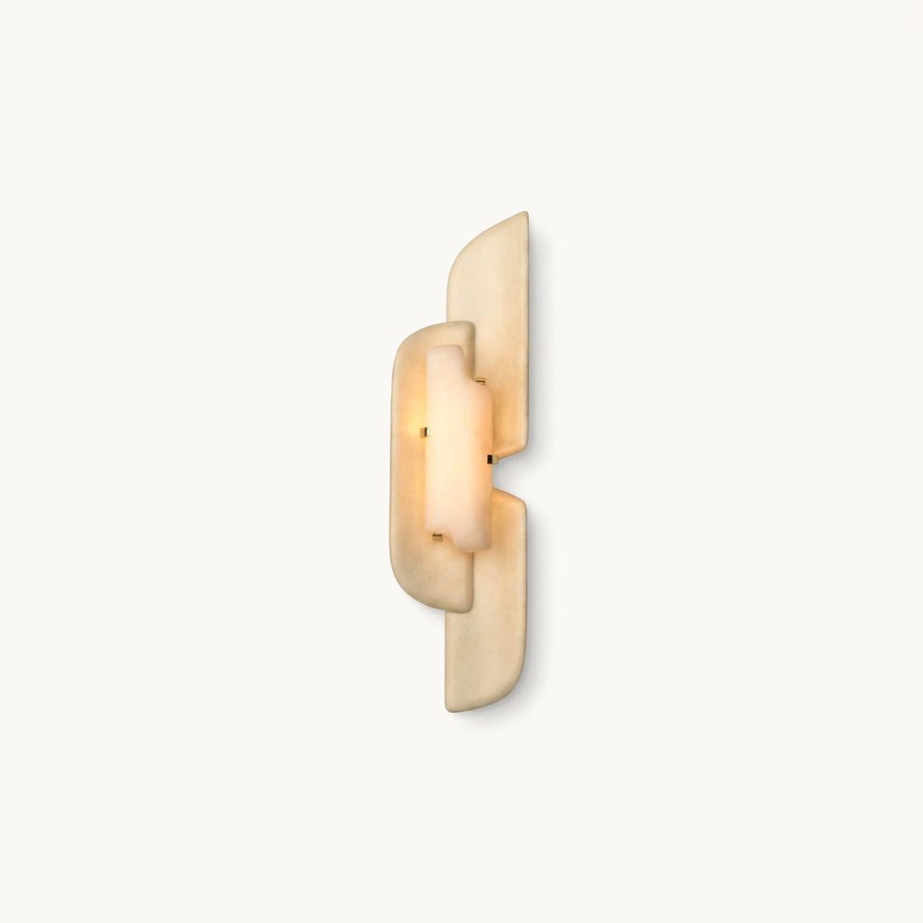 A slim Clérachic wall lamp of layered beige panels with a glowing alabaster centre, shown on a plain white backdrop.