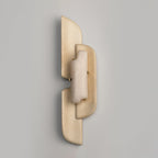 The same Clérachic wall lamp switched off on a grey wall, its alabaster panel pale and its beige layers overlapping.