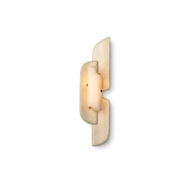 A Clérachic wall lamp lit on a white backdrop, its beige panels overlapping around a glowing alabaster core.