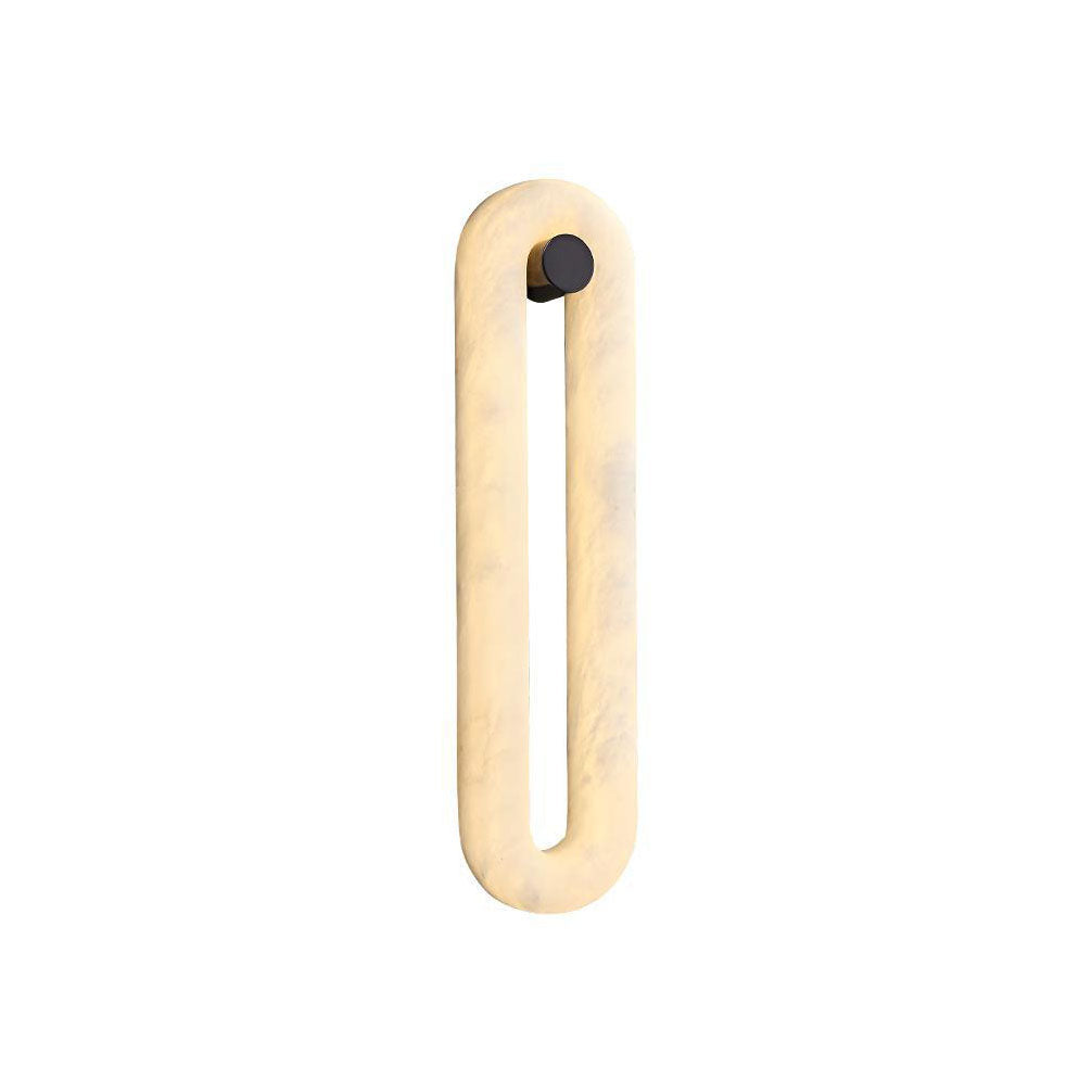 Clérachic Alabaster Wall Sconce lit against a plain white background, the whole oval loop glowing with no visible bulb.