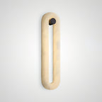 Clérachic Alabaster Wall Sconce lit and shown alone at an angle, warm light rising through the honey-veined stone.