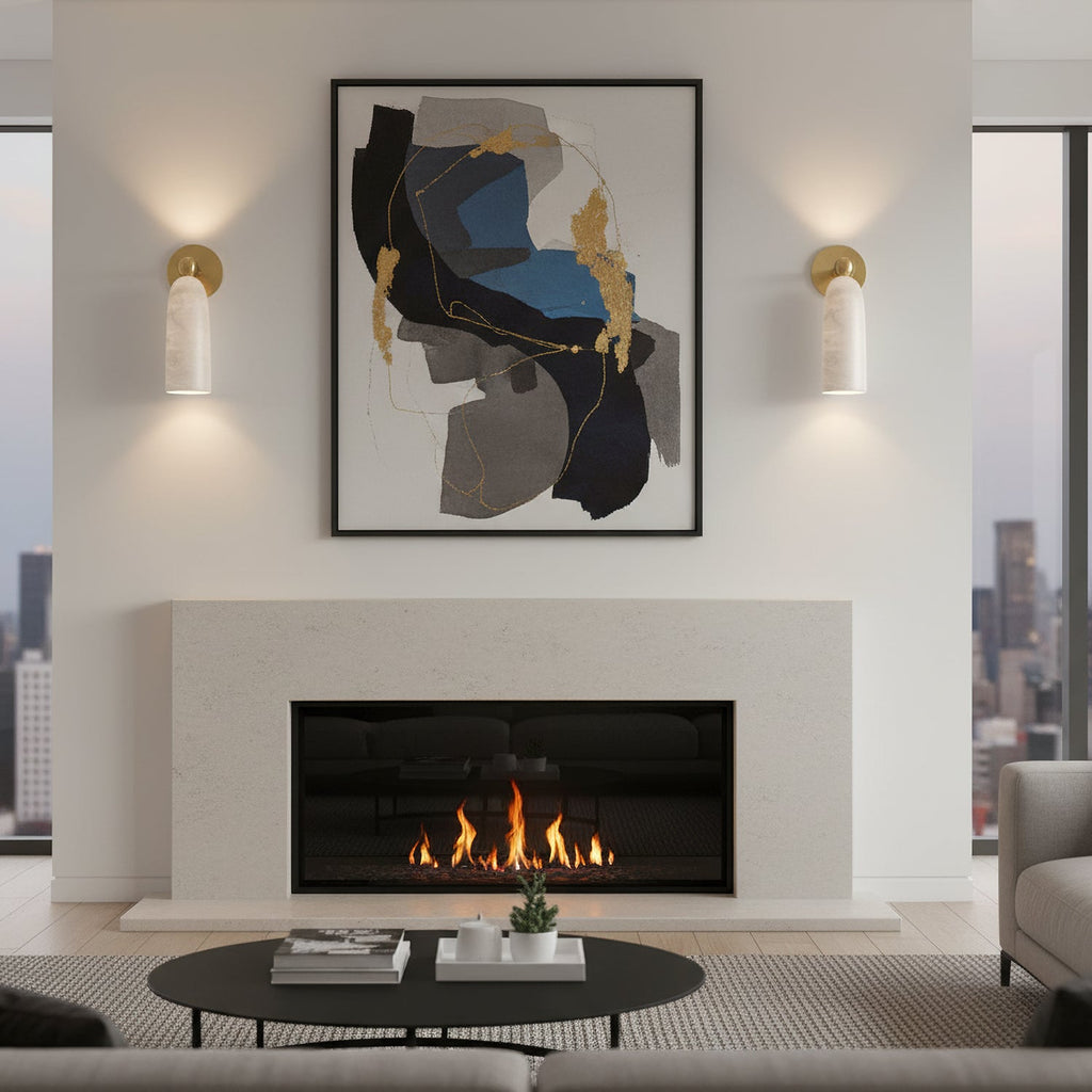 Clérachic alabaster sconces on either side of a framed abstract print above a linear fireplace, casting light up and down the wall.