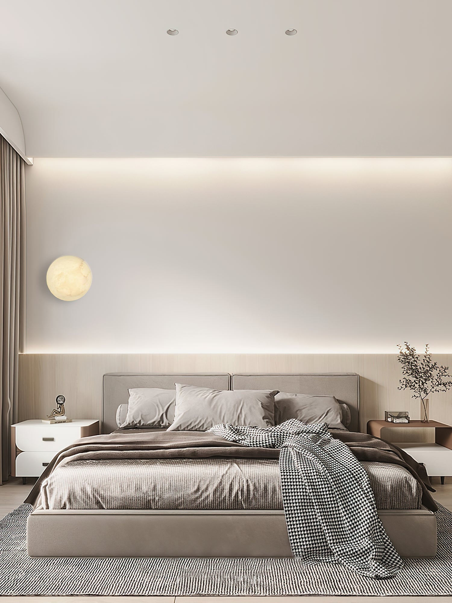 Clérachic Alabaster Wall Sconce on a bedroom wall by the curtain, its warm disc reading against cove-lit plaster.